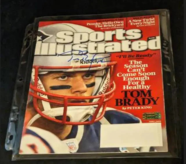 A Tom Brady Autographed sports illustrated magazine with COA